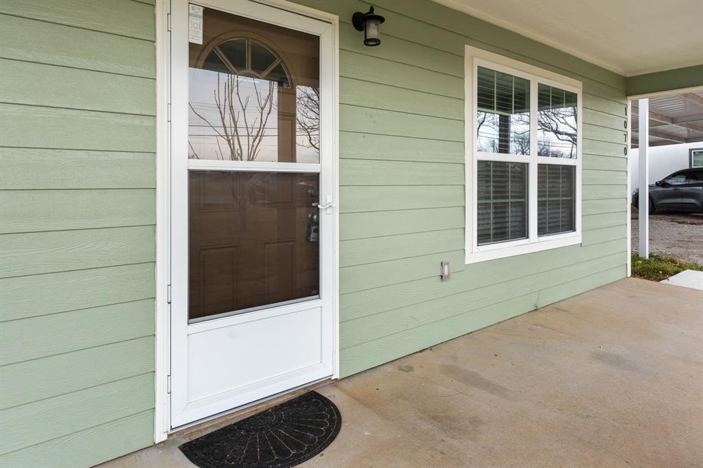 1070 East Reno Road Azle, TX 76020 - Photo 3 of 19 a view of front door of a house