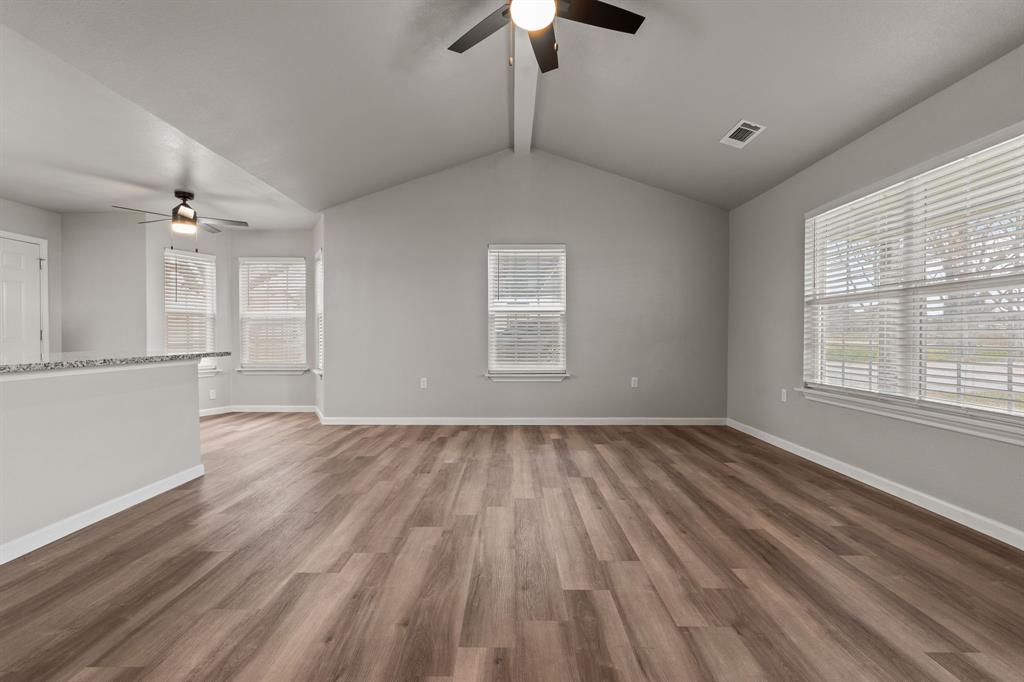 1070 East Reno Road Azle, TX 76020 - Photo 5 of 19 wooden floor in an empty room with a window