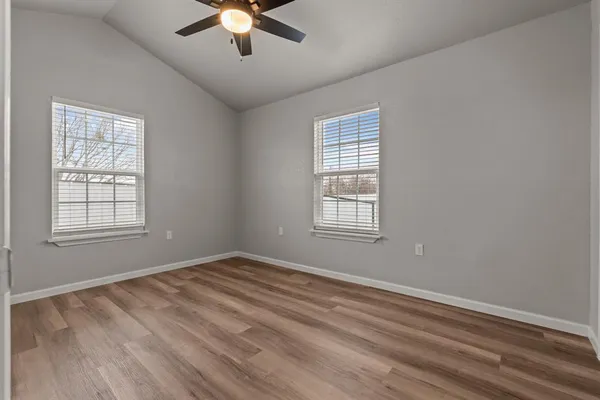 a view of room with window and ceiling fan