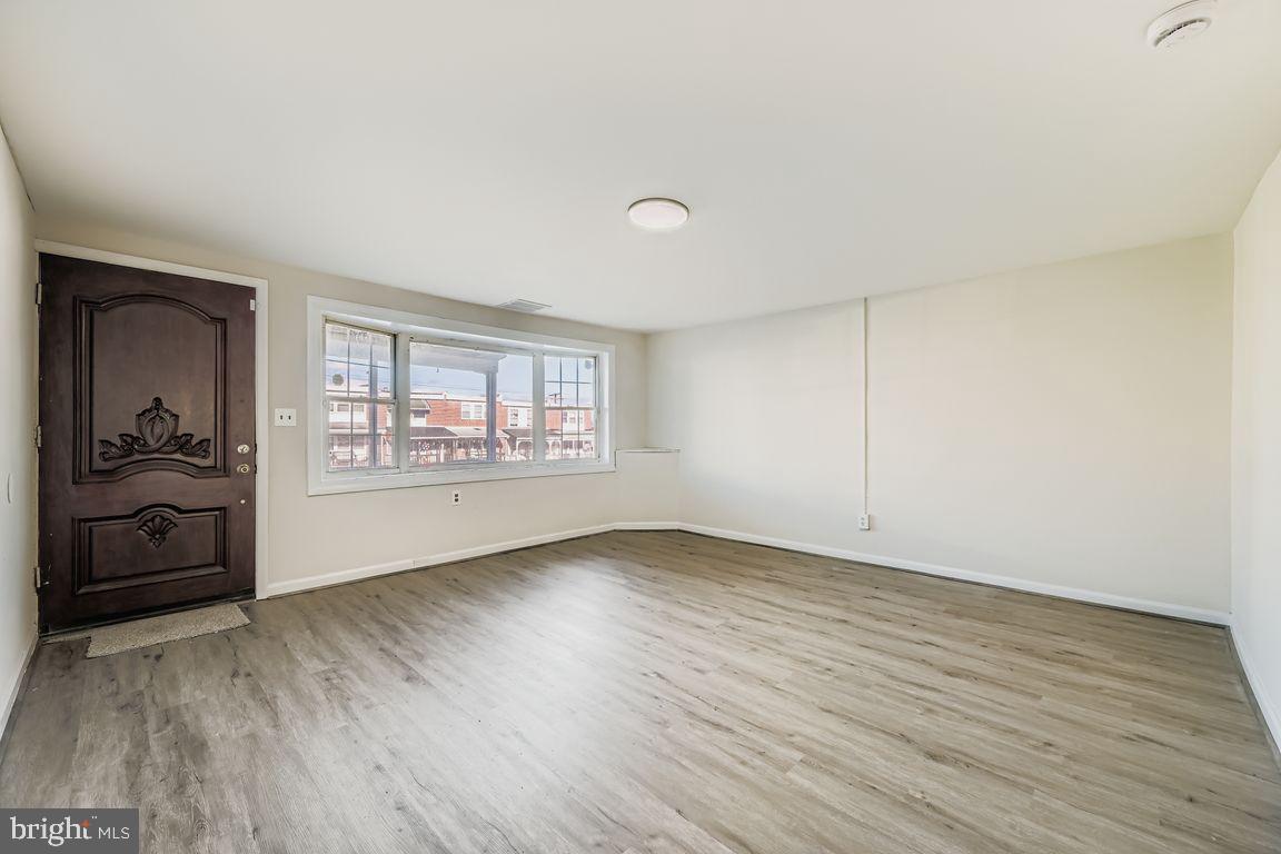 2725 Yarnall Road Baltimore, MD 21227 - Photo 4 of 21 Spacious LR -all new LVP Flooring on Main