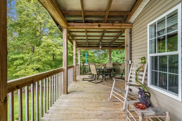 a front view of a house with a yard table and chairs