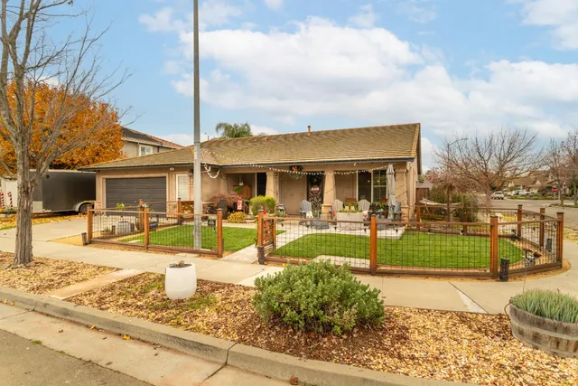 a house view with a sitting space and garden space