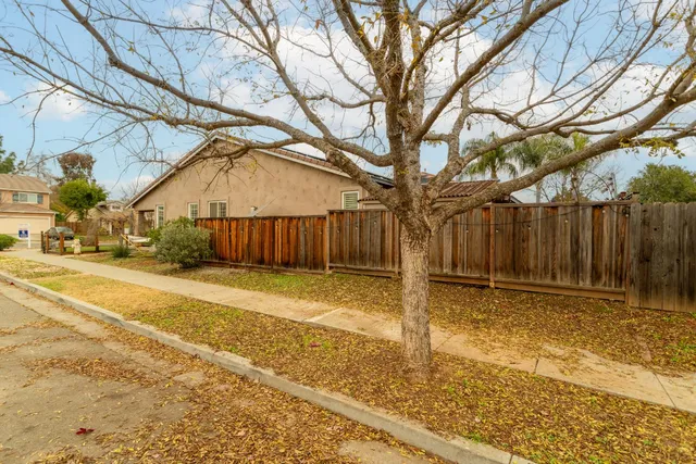 a bedroom with a bed and a television