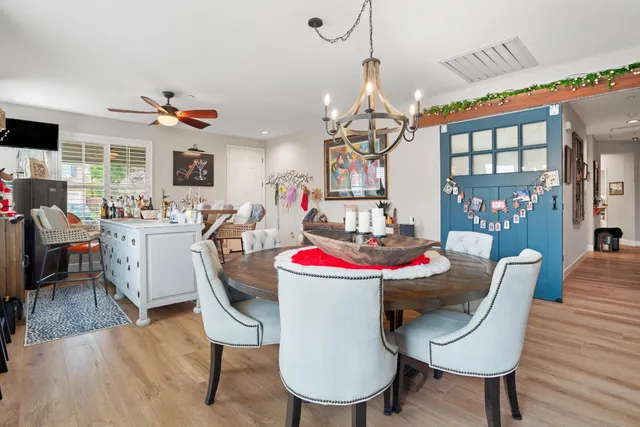 a view of a dinning table and chairs in the room