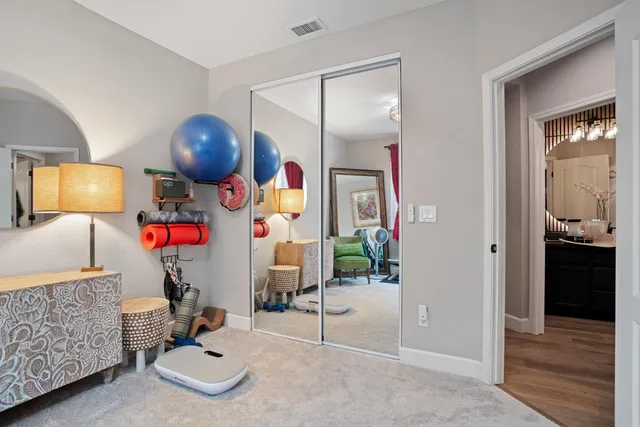 a play room with furniture and wooden floor