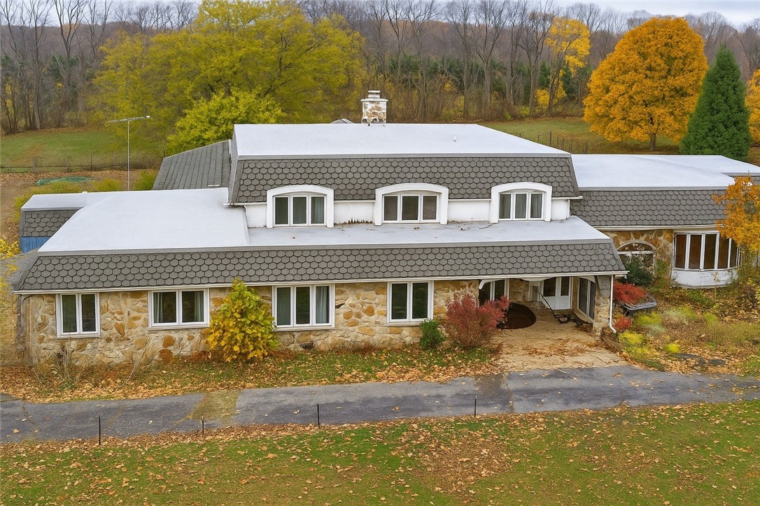 Contemporary Cape Cod with 17 acres and in door in