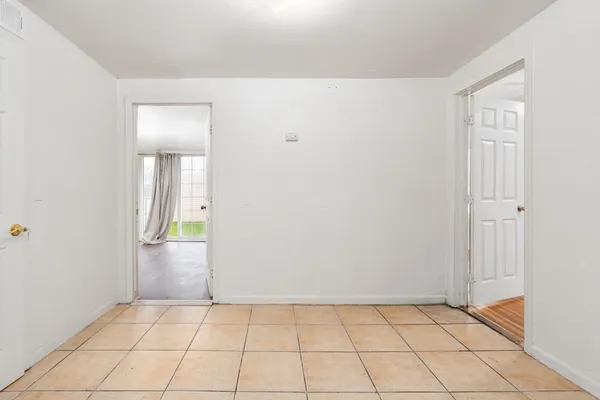 an empty room with mirror
