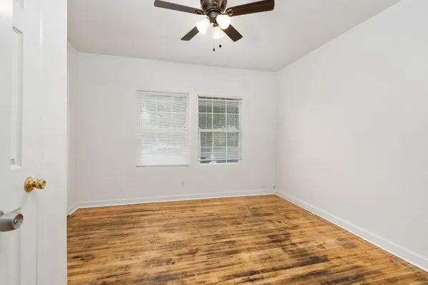a view of an empty room with a window