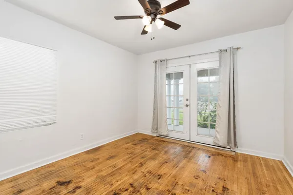 a view of an empty room with a window