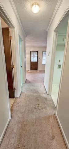 a view of an empty room with windows