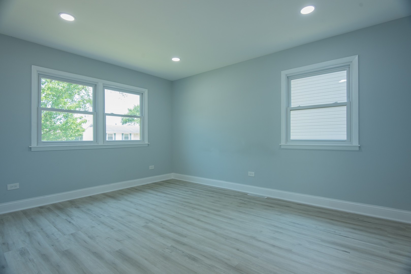 44 Redwood Trail Wheeling, IL 60090 - Photo 11 of 23 an empty room with wooden floor and windows