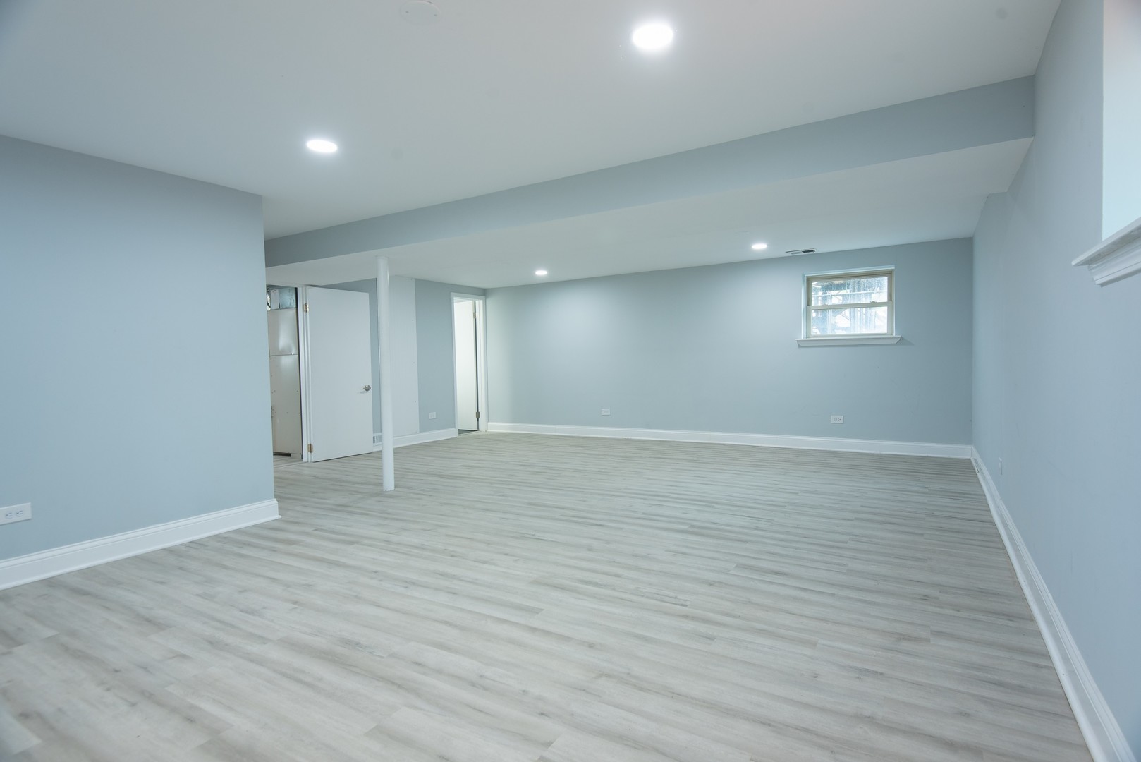 44 Redwood Trail Wheeling, IL 60090 - Photo 16 of 23 a view of an empty room with wooden floor and a window
