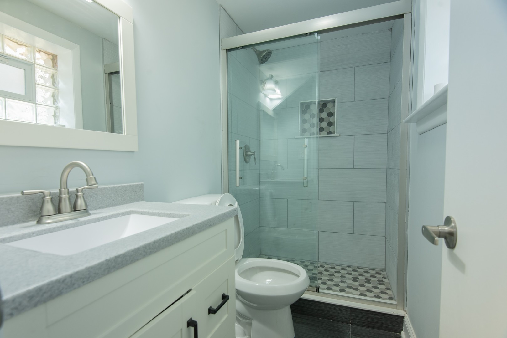 44 Redwood Trail Wheeling, IL 60090 - Photo 17 of 23 a bathroom with a sink toilet and shower