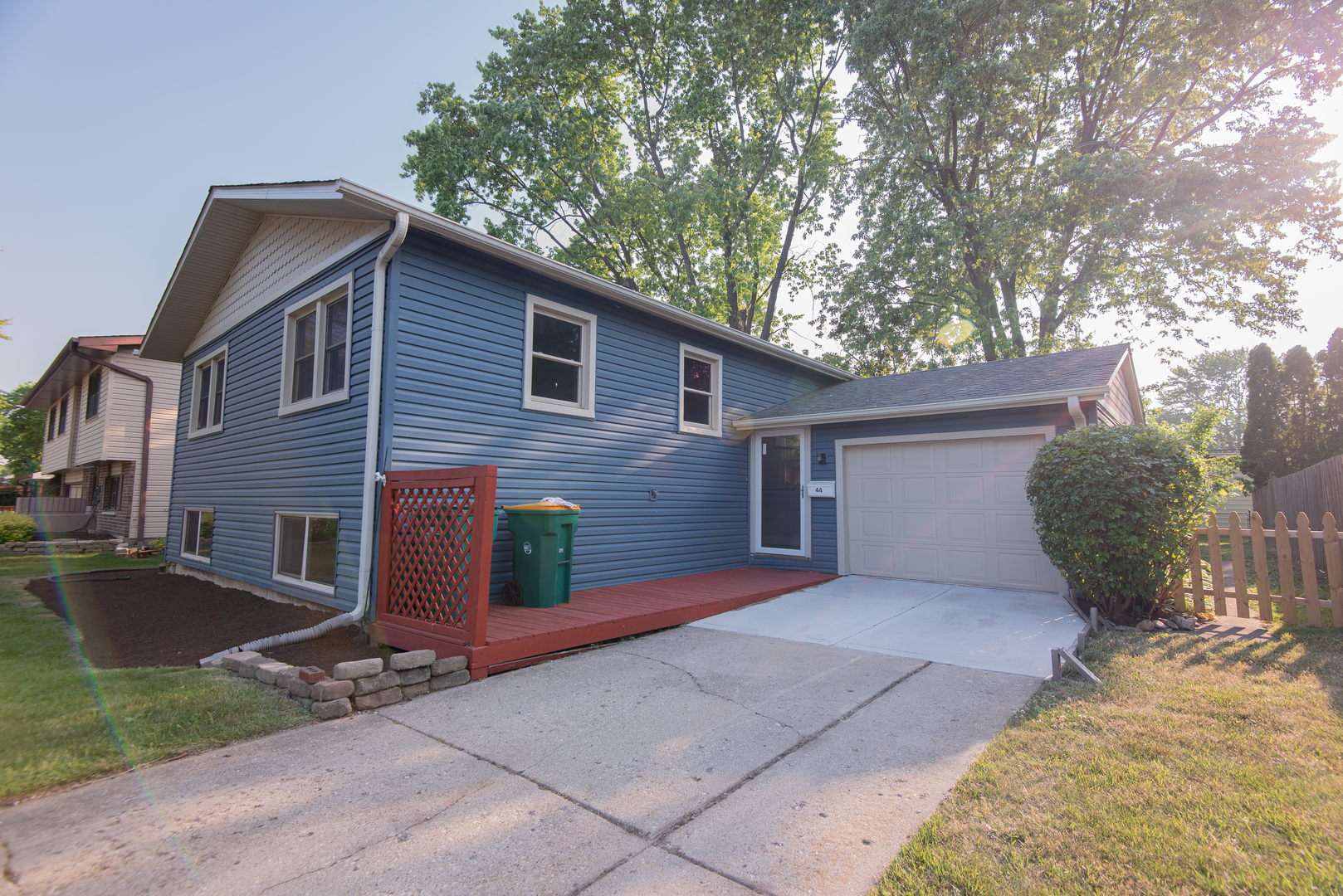 44 Redwood Trail Wheeling, IL 60090 - Photo 2 of 23 a front view of a house with garden