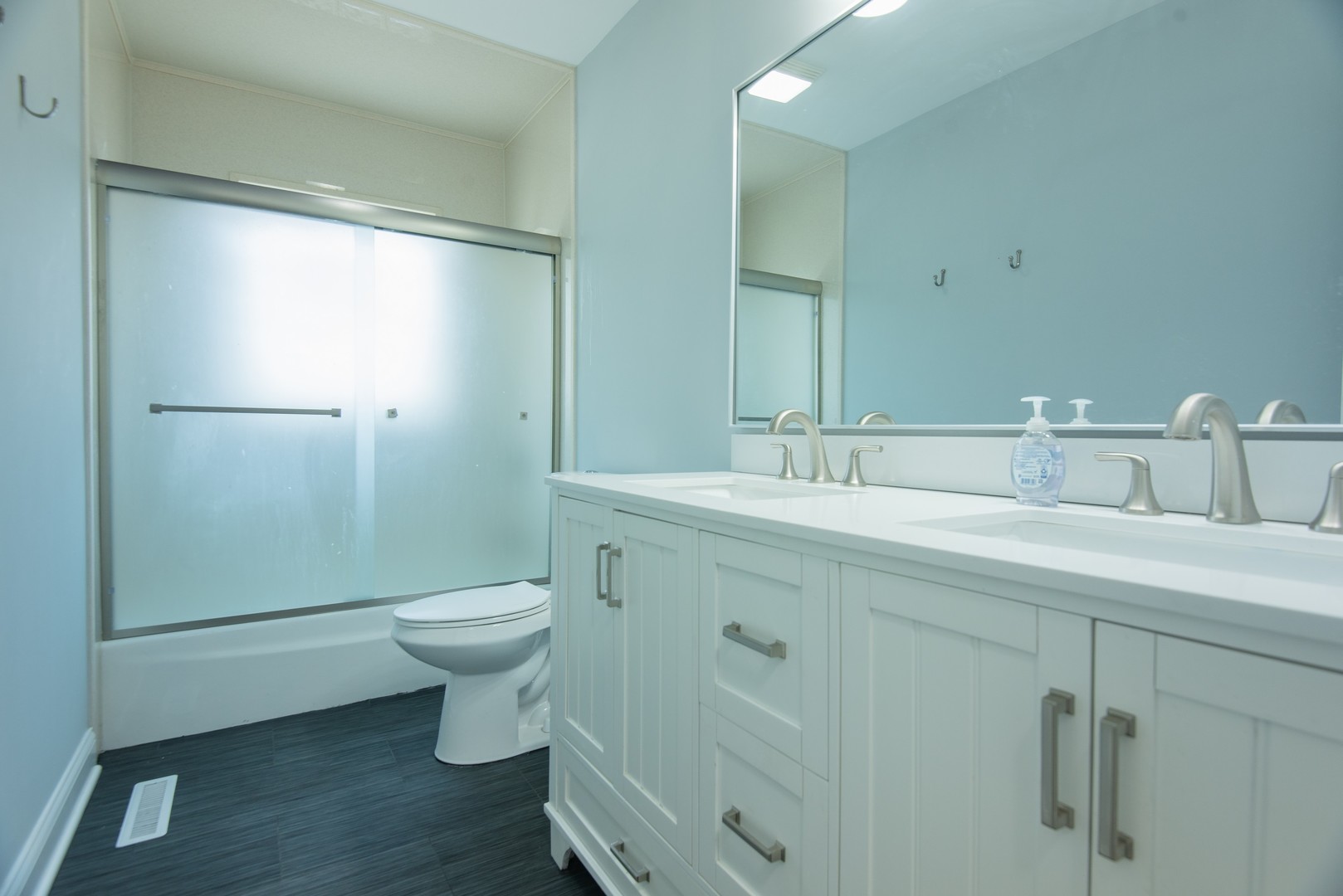 44 Redwood Trail Wheeling, IL 60090 - Photo 10 of 23 a bathroom with a double vanity sink toilet and shower