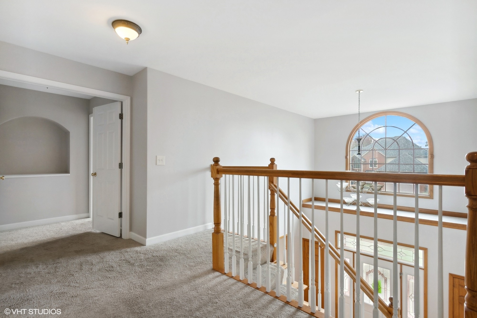 2908 Beth Lane Naperville, IL 60564 - Photo 11 of 22 a view of staircase with railing and a chandelier fan