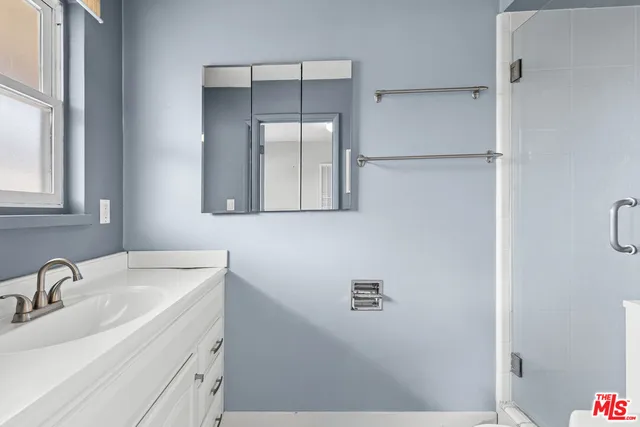 a bathroom with a sink and mirror