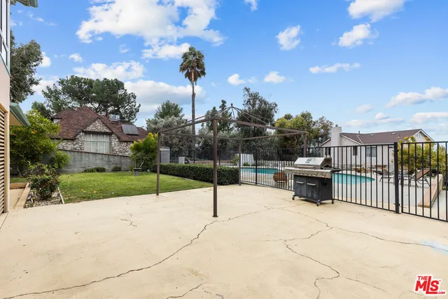 a view of a patio with a yard