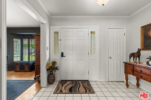 a room with gym equipment and a rug