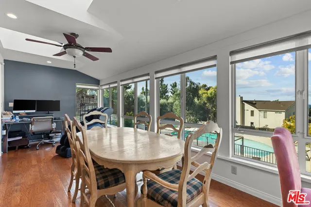 a view of a dining room with furniture window and outside view