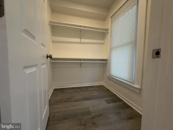 a view of an empty walk in closet