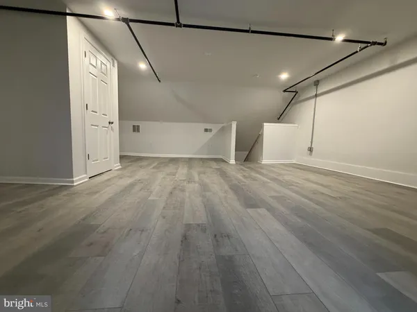 a view of a livingroom with wooden floor