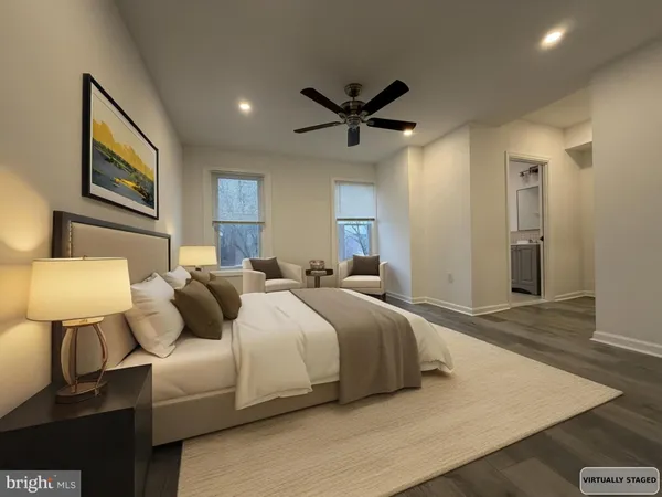 a bedroom with a bed and a lamp