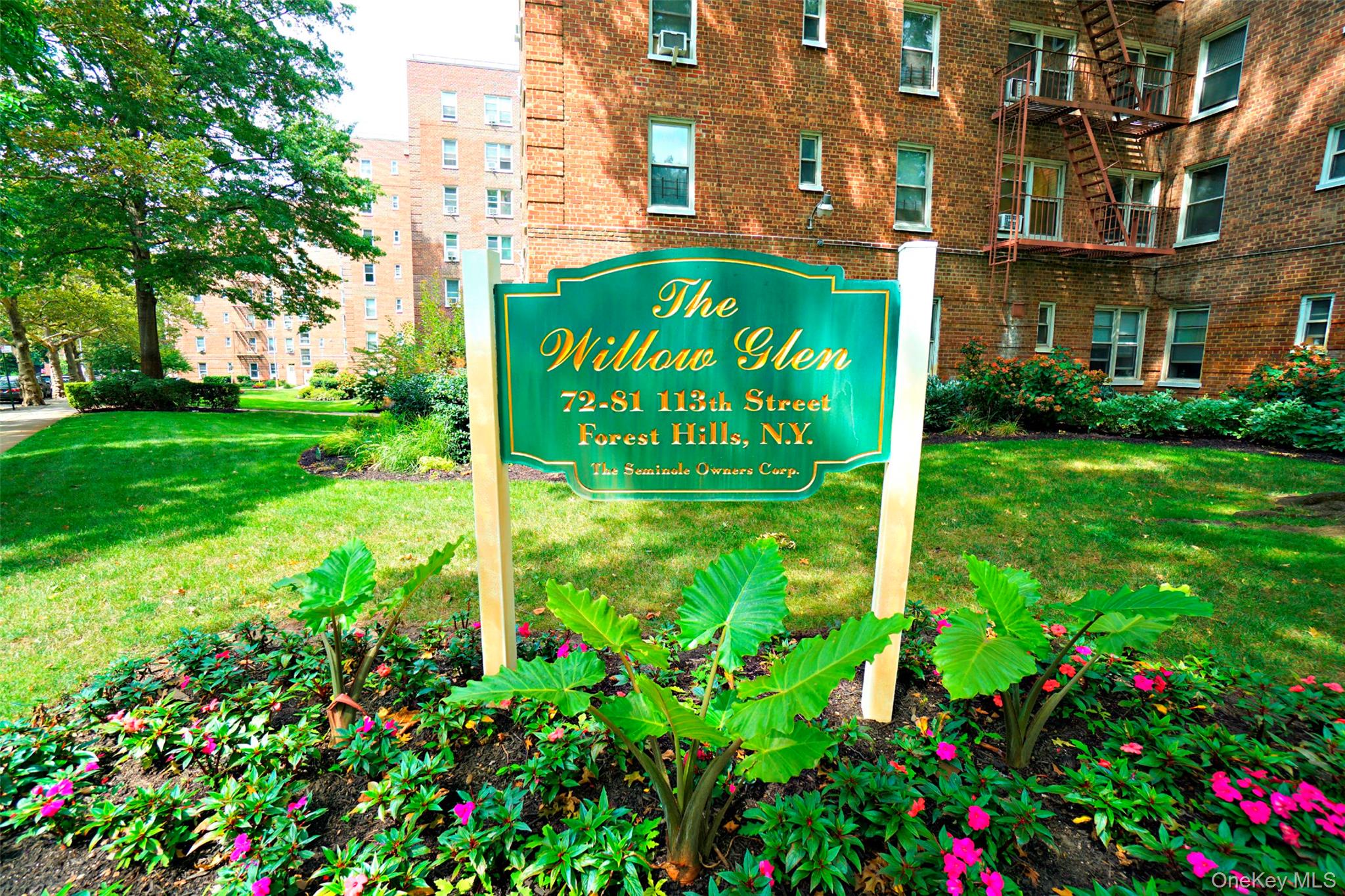 7281 113th Street, Unit 2B Queens, NY 11375 - Photo 13 of 18 a sign broad in front of a brick building
