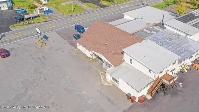 an aerial view of a house with a swimming pool
