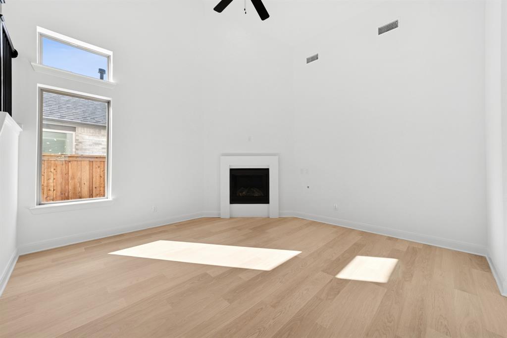 1842 Cole Road Van Alstyne, TX 75495 - Photo 10 of 35 a view of an empty room with wooden floor and a window