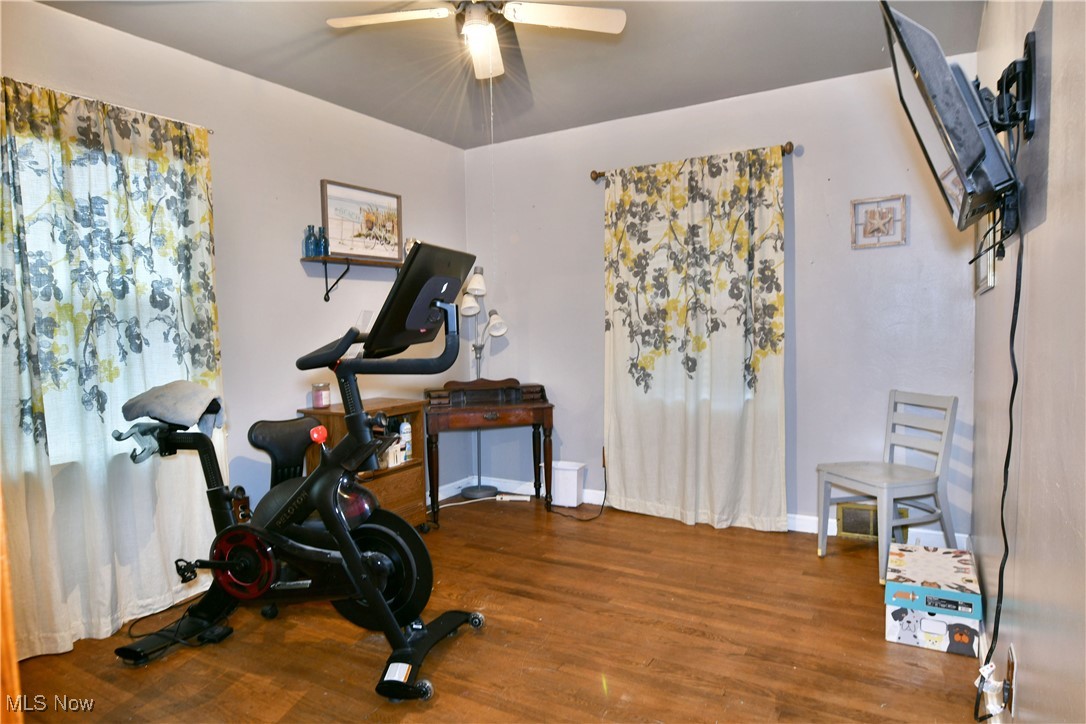 3224 Reeves Road Northeast Warren, OH 44483 - Photo 28 of 49 Workout area with dark wood finished floors and ceiling fan