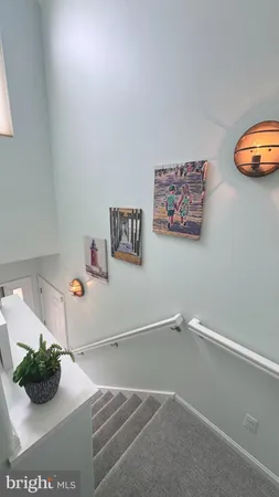 a kitchen with white cabinets appliances and sink