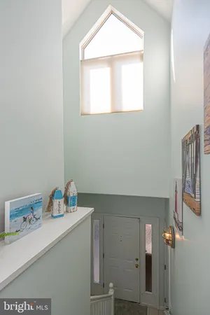 a kitchen with cabinets appliances a sink and a window