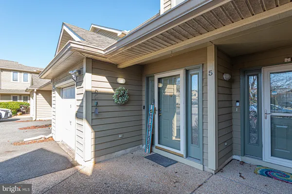 a view of a house with a door and balcony
