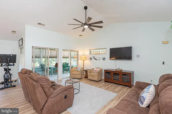 a view of a room with a ceiling fan