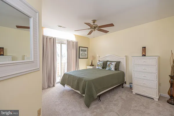 a bedroom with two beds and a window