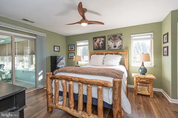 a white toilet sitting next to a bath tub and a shower