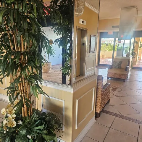 a lobby with furniture and garden