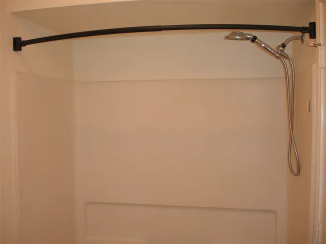 a white toilet sitting next to a cabinets