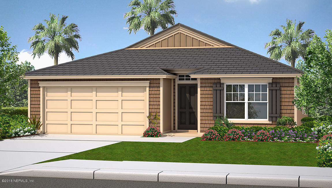 3857 Bronco Road Middleburg, FL 32068 - Photo 1 of 5 a front view of a house with a yard and garage