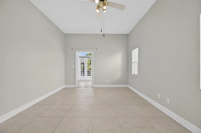 a spacious bathroom with a tub sink and mirror