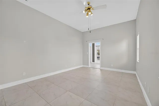 a large white kitchen with a sink and cabinets