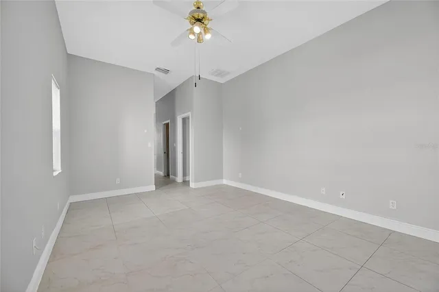 a spacious bathroom with a granite countertop tub shower and a sink