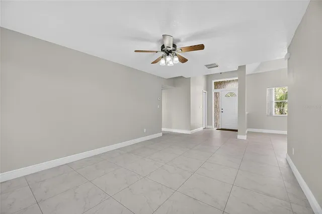 wooden floor in an empty room and a window