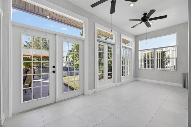 a large kitchen with granite countertop a sink and dishwasher with a dining table