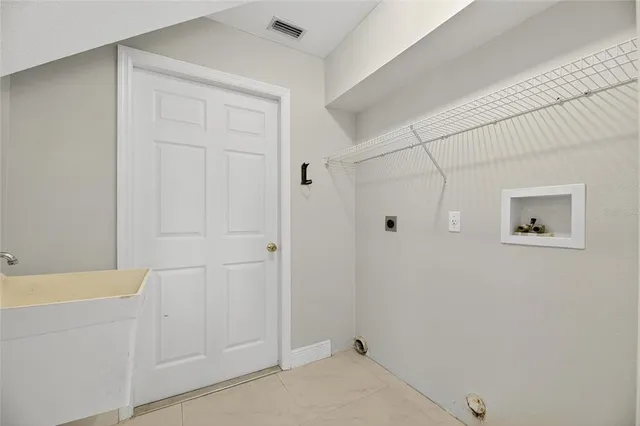 a backyard of a house with lots of green space and lake view