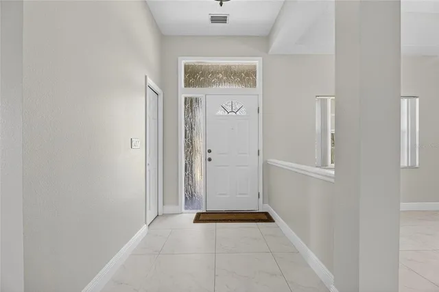 a view of an empty room with a window