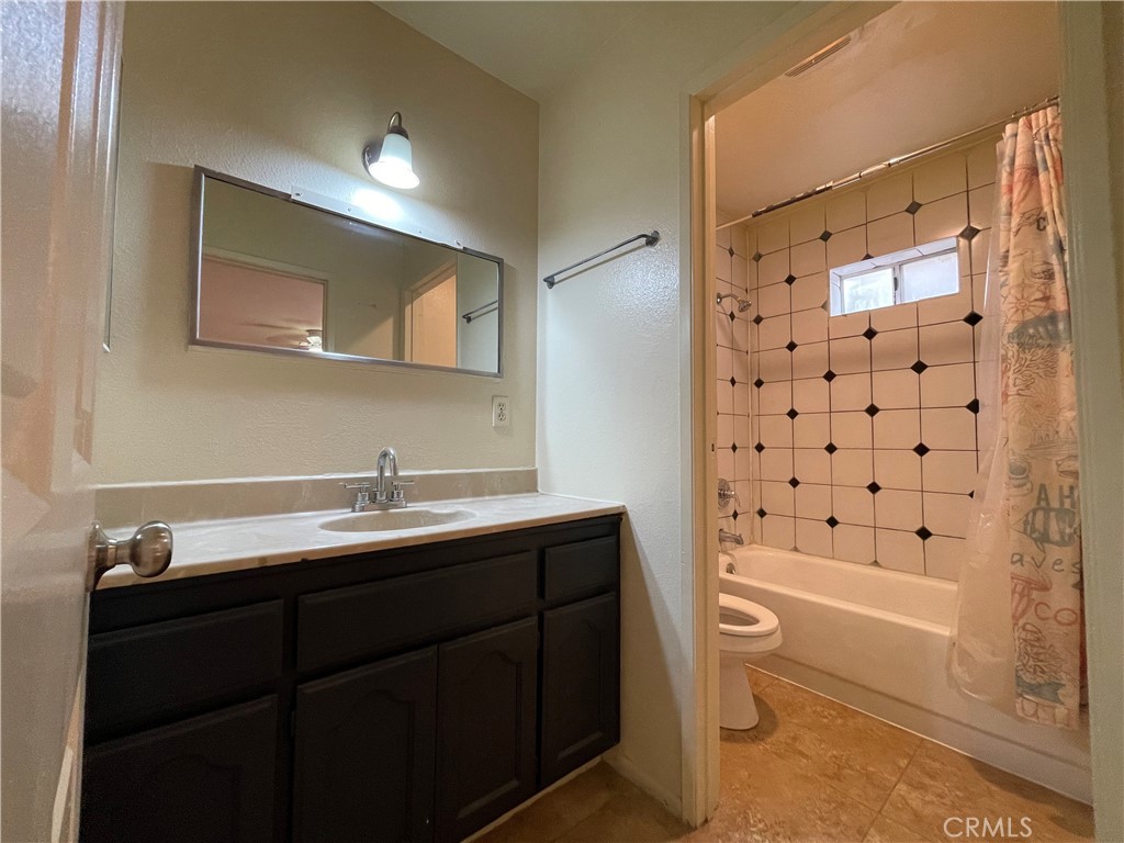 1349 Walnut Avenue Long Beach, CA 90813 - Photo 11 of 13 a bathroom with a sink a toilet and shower