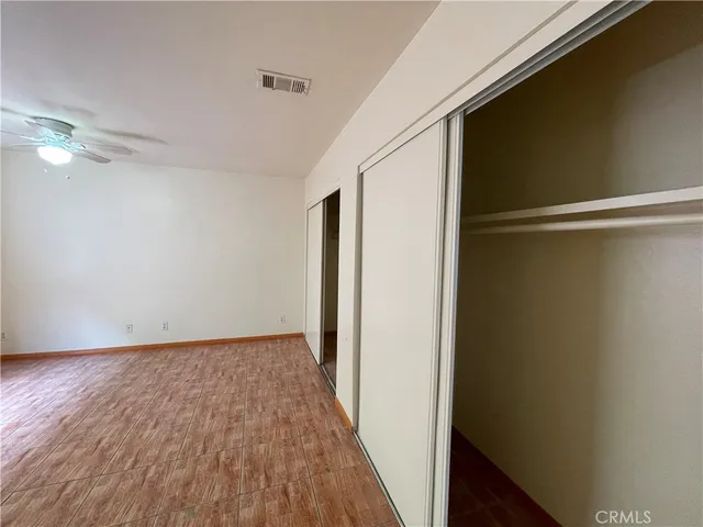 a view of hallway with wooden floor