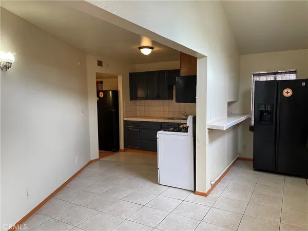 a kitchen with kitchen island cabinets and oven
